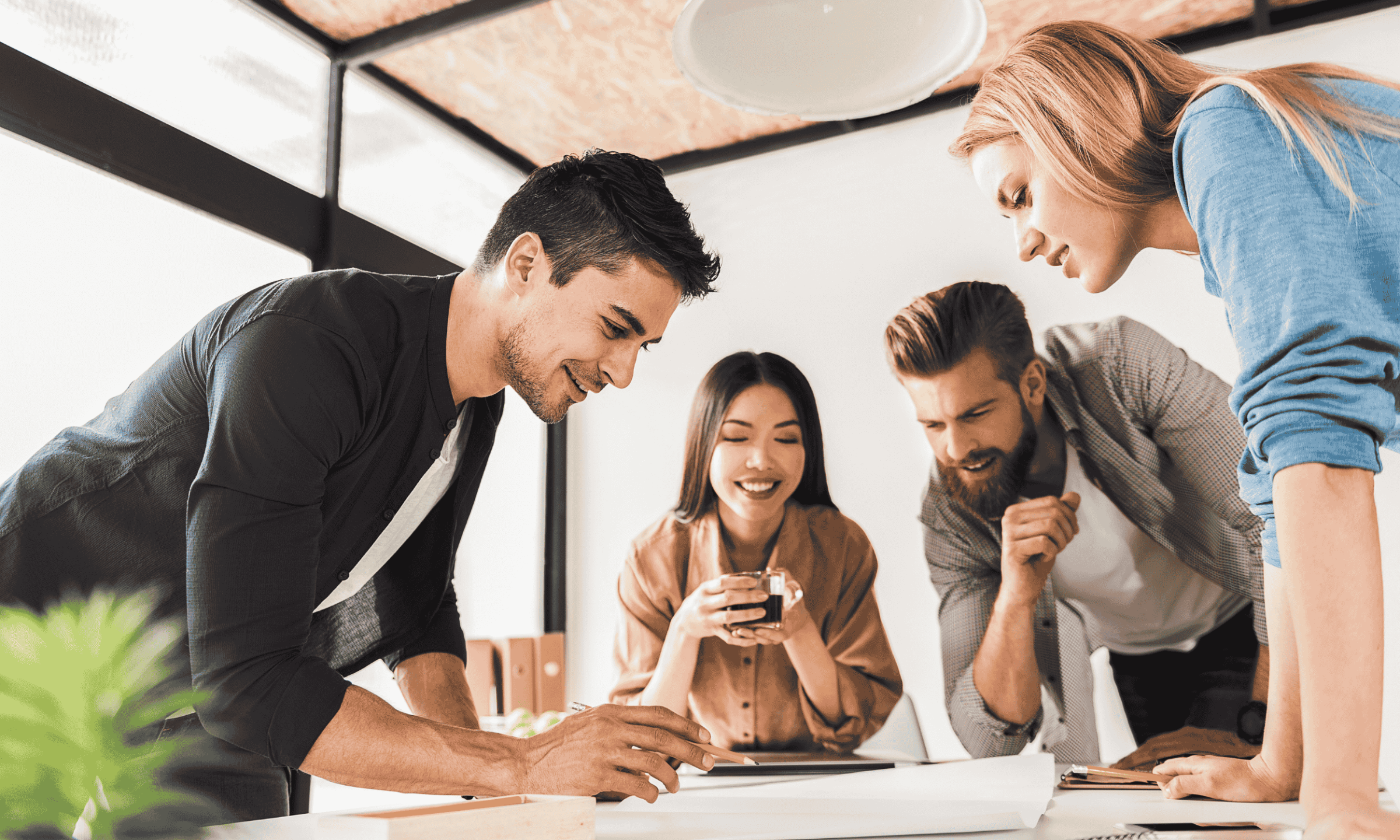 Entrepreneurs collaborating and celebrating progress