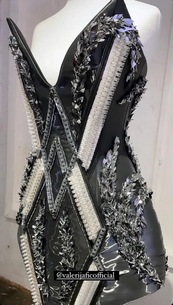 Black beaded couture corset displayed on a mannequin