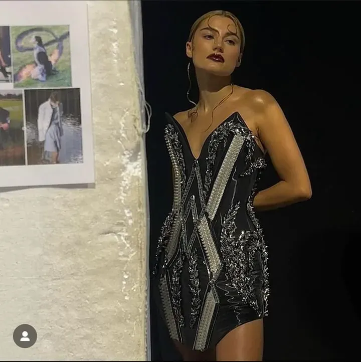 Model in a hand-beaded sequinned couture mini dress by Valerija Fic