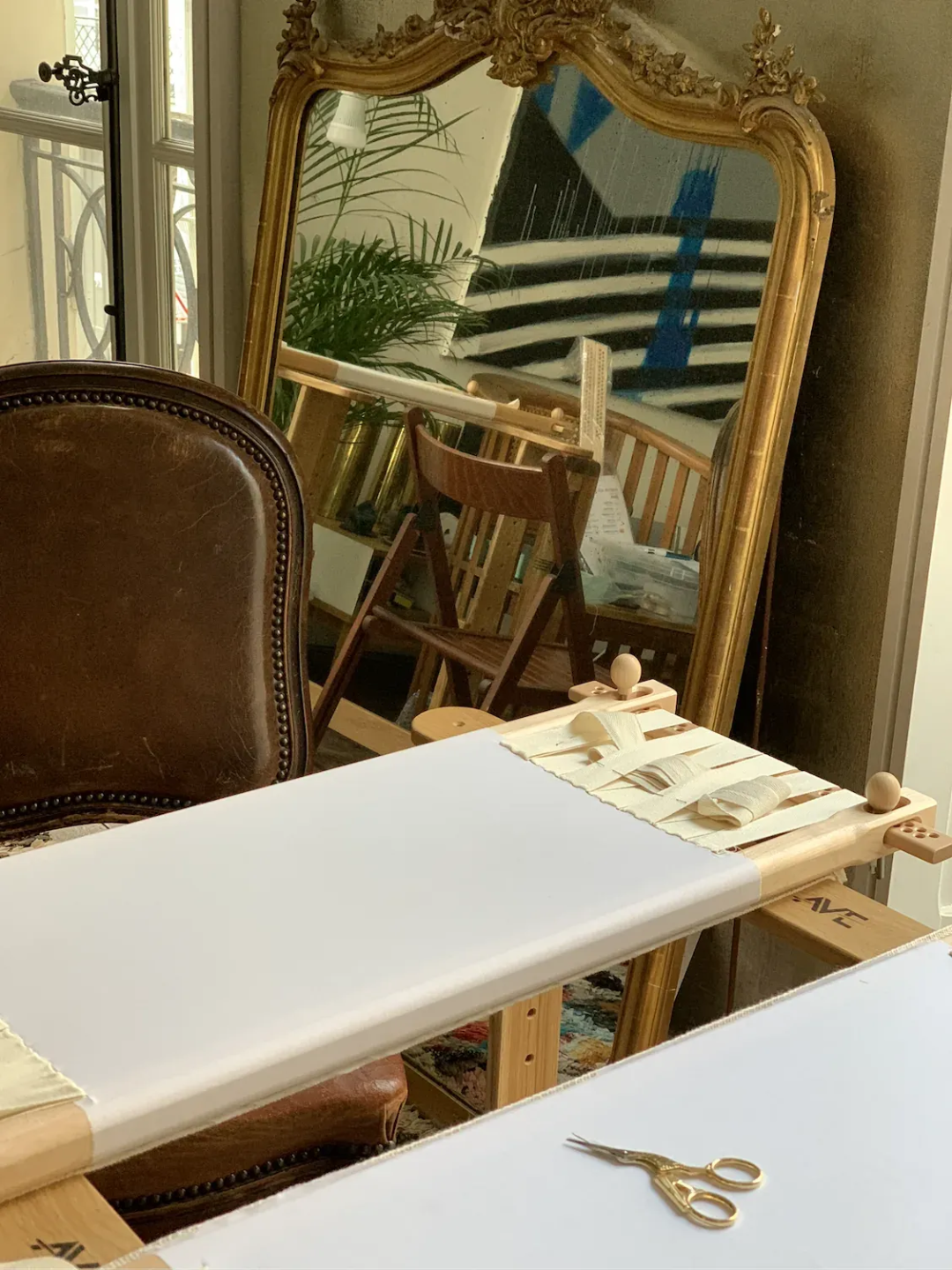 Valerija Fic's haute couture atelier with an easel and worktable