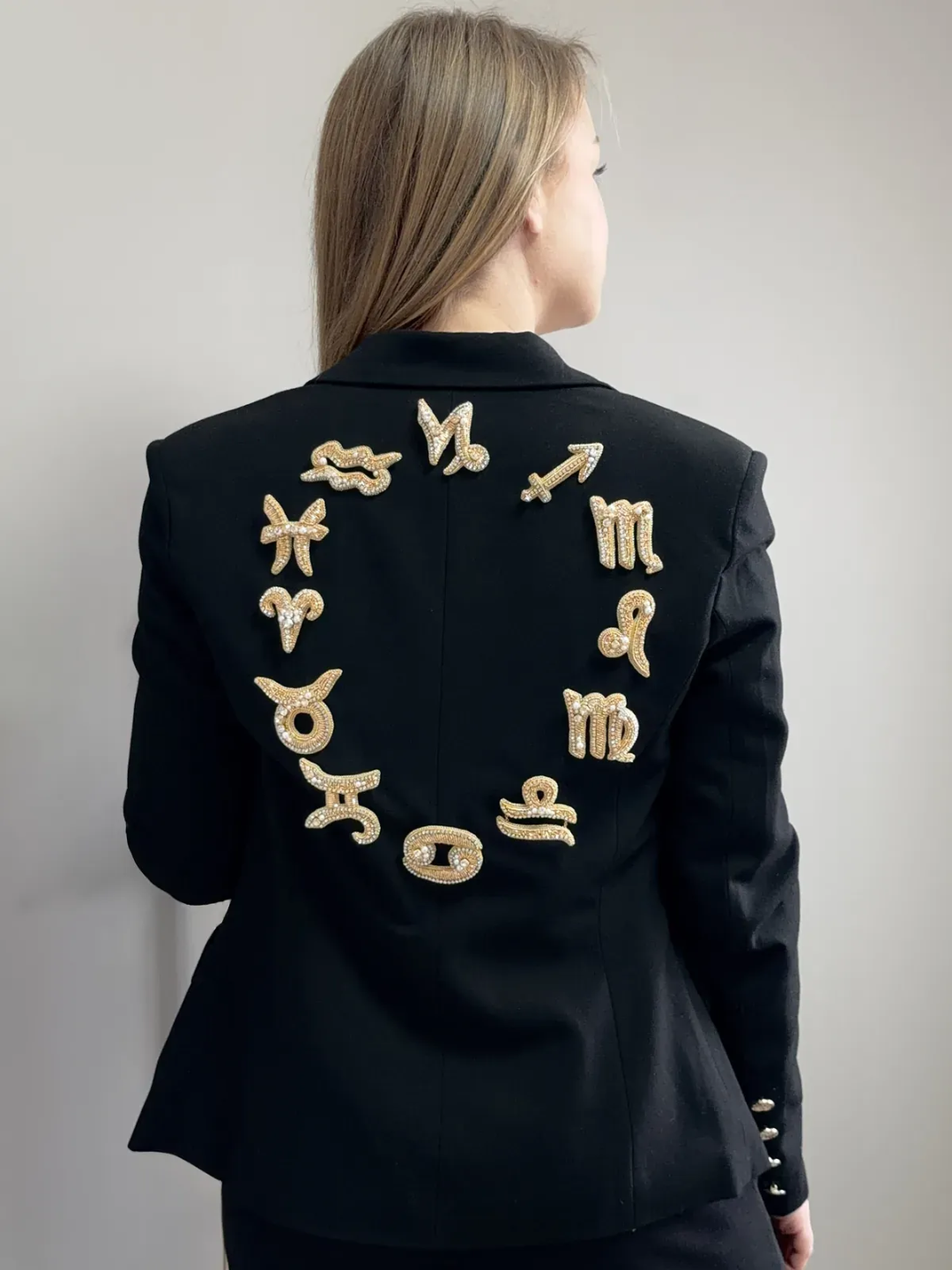 Gold zodiac goldwork embroidery on a black blazer, couture piece by a School of Couture student