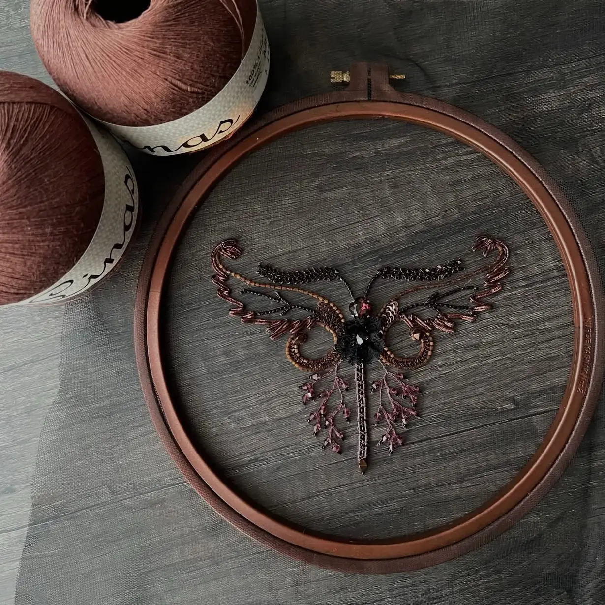 Student work from School of Couture: beaded tambour embroidery ornament on tulle in a wooden hoop