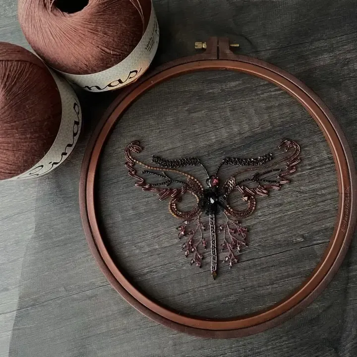 Student work from School of Couture: beaded tambour embroidery ornament on tulle in a wooden hoop