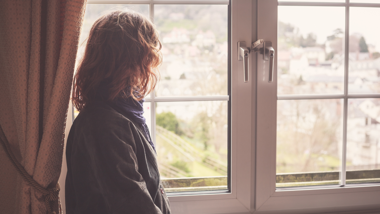 A woman looking out a window