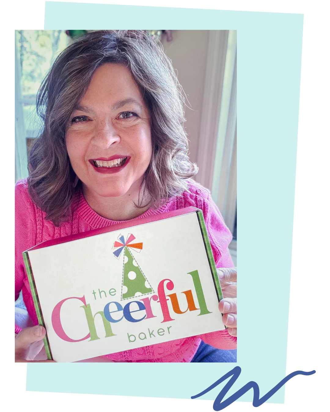 items from the Literary Book Club subscription displayed on a table and surrounded by flowers.