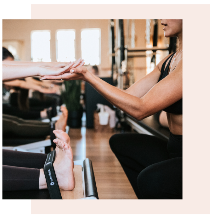 pilates instructor working with client