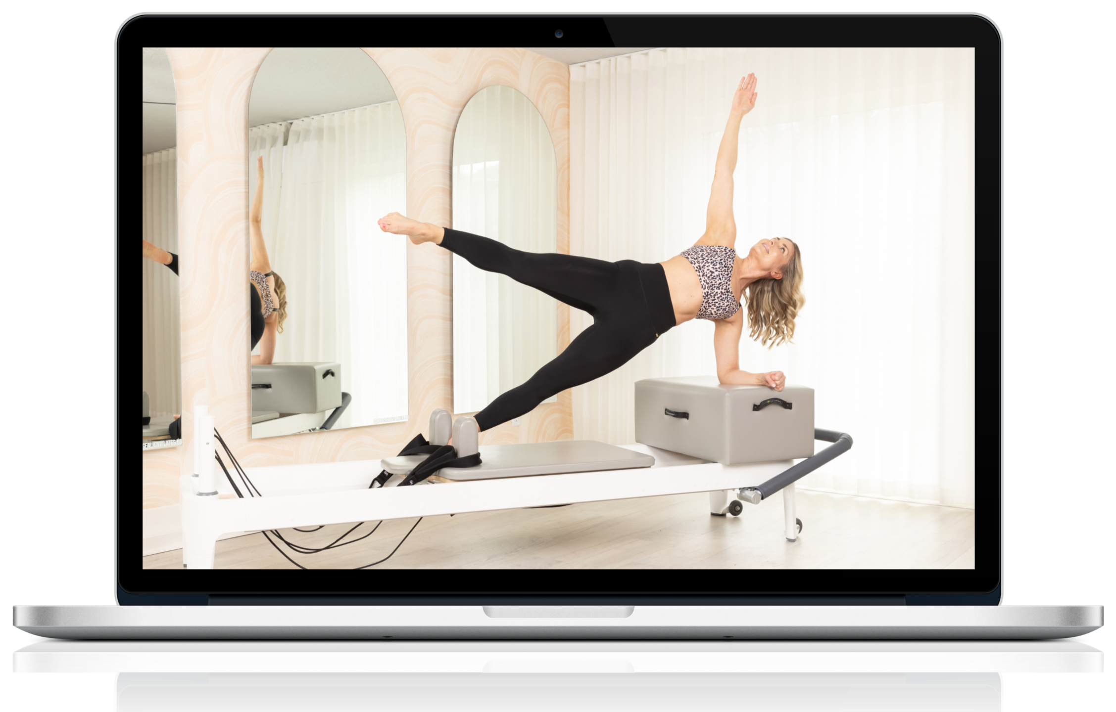 Suzie working out on a reformer