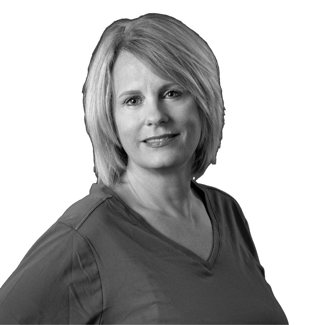 Woman with short straight hair wearing a casual top, facing forward against a plain background with a slight smile