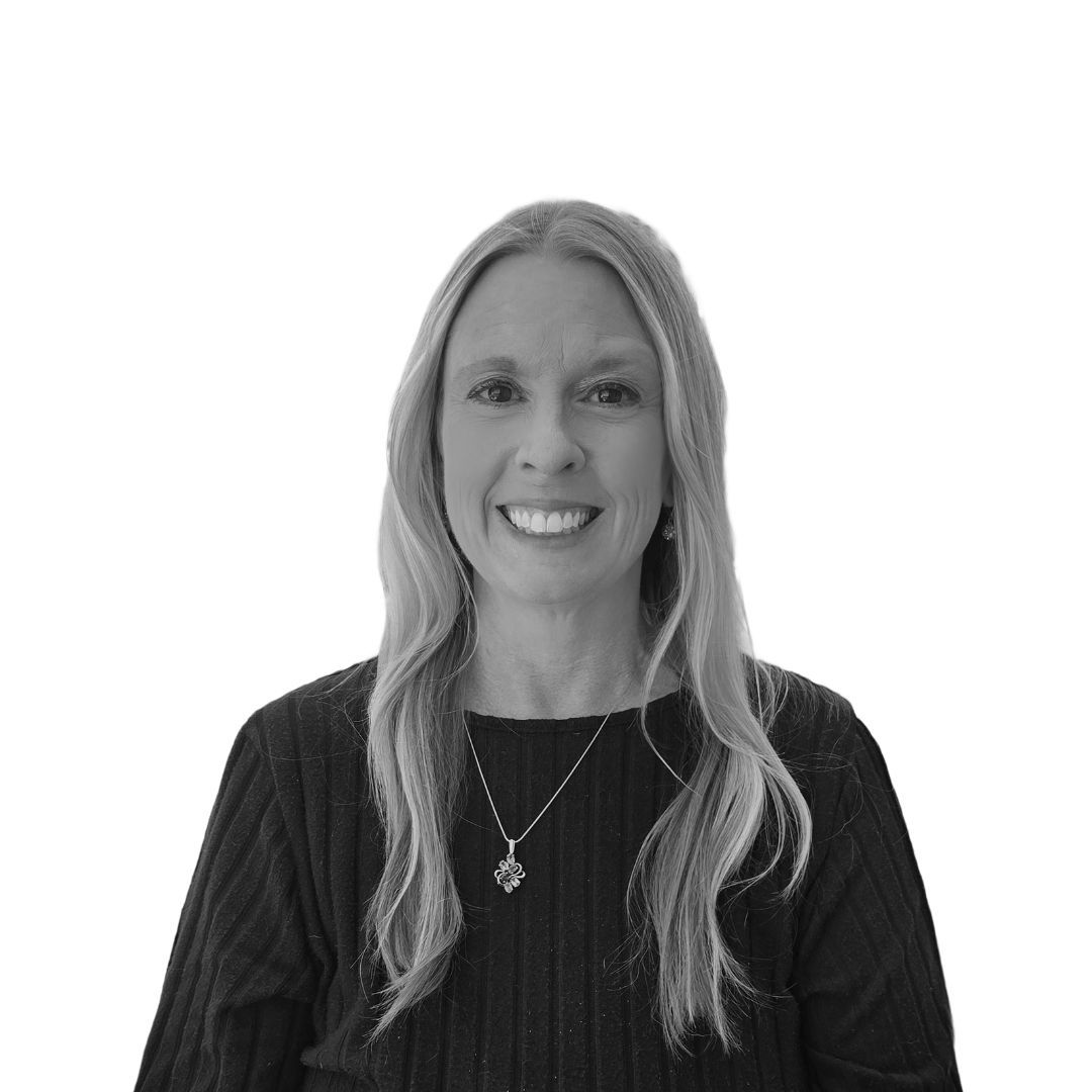 Smiling woman with long straight blonde hair wearing a dark top and pendant necklace, facing forward against a plain background