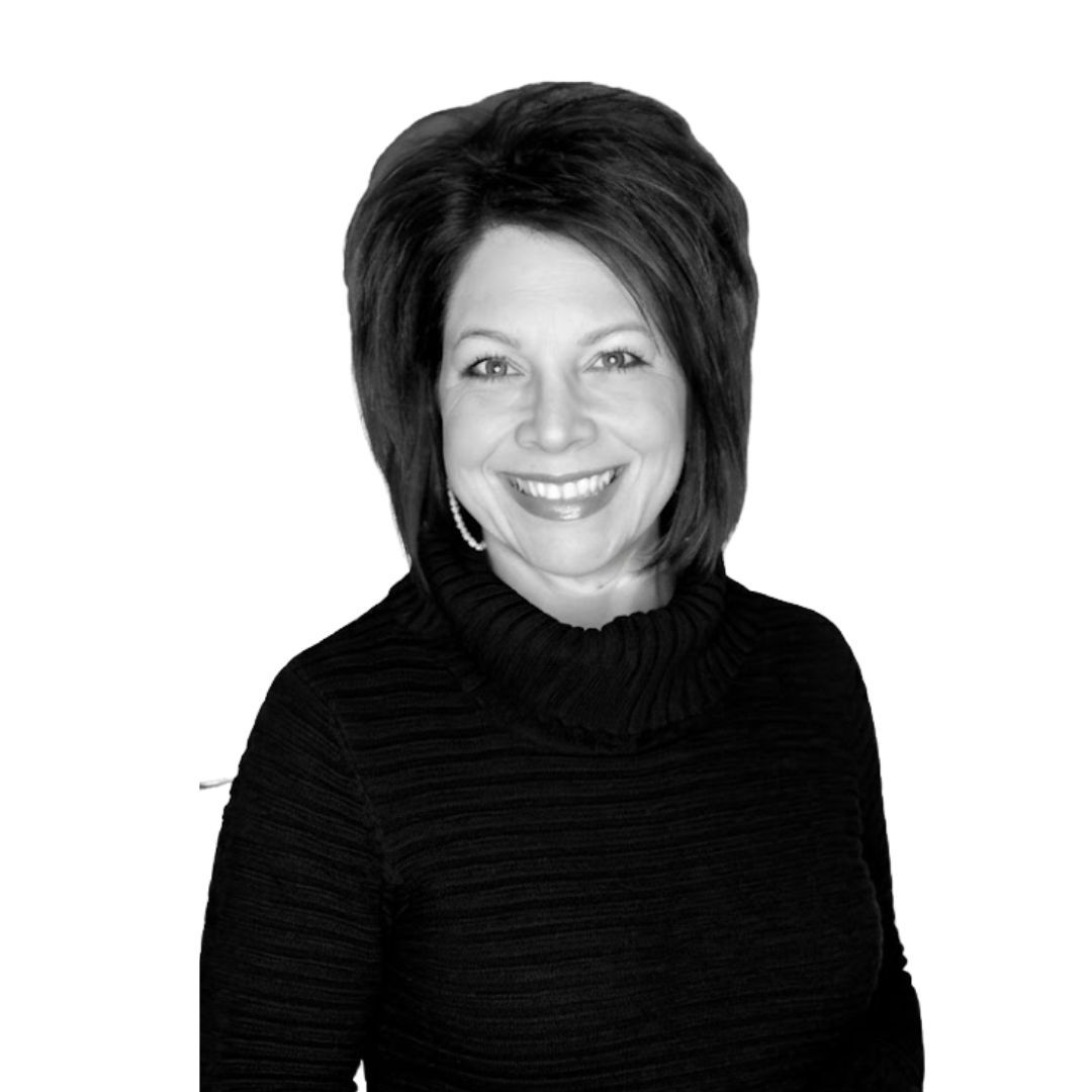 Smiling woman with voluminous shoulder-length hair wearing a dark turtleneck sweater and hoop earrings, facing forward against a plain background