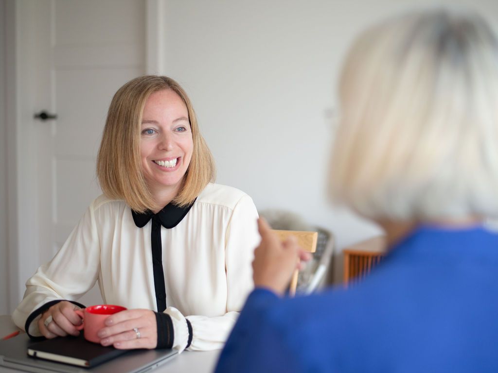 Professional procurement mentoring session - career development meeting between two businesswomen