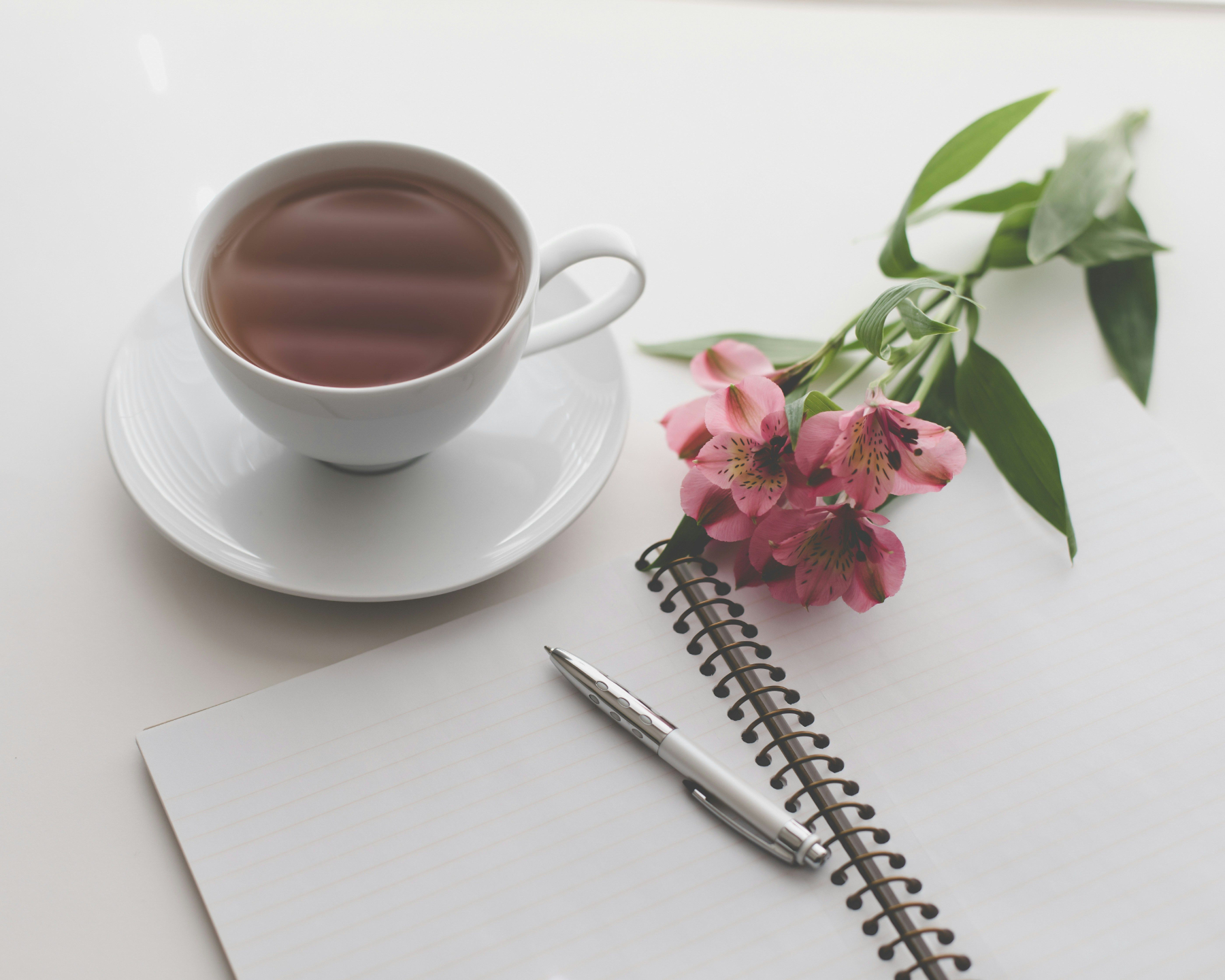 Notebook, flowers and cup of tea – The Inner Spark newsletter by Cheryl Simon