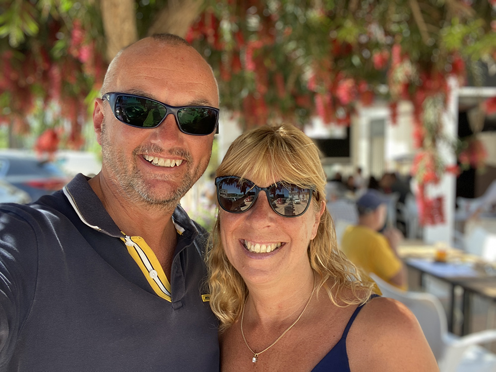 Andy Brown, Kajabi Expert and his wife Jules on a yacht in Spain