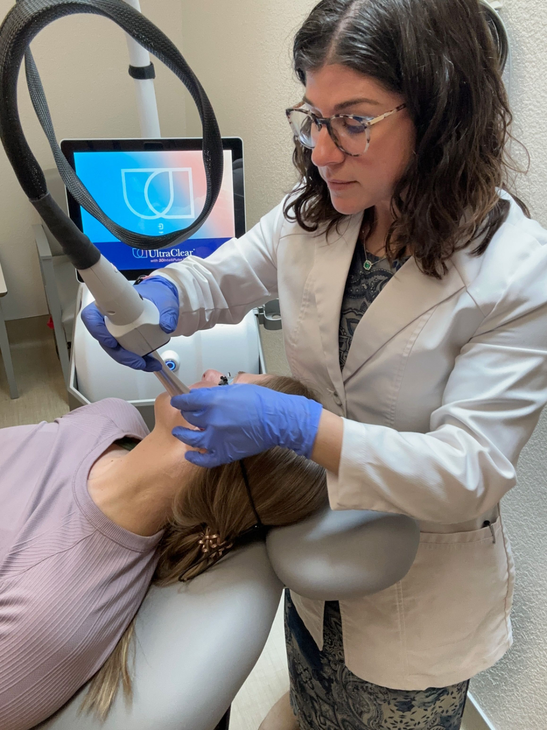 Dr. Schneider using the laser