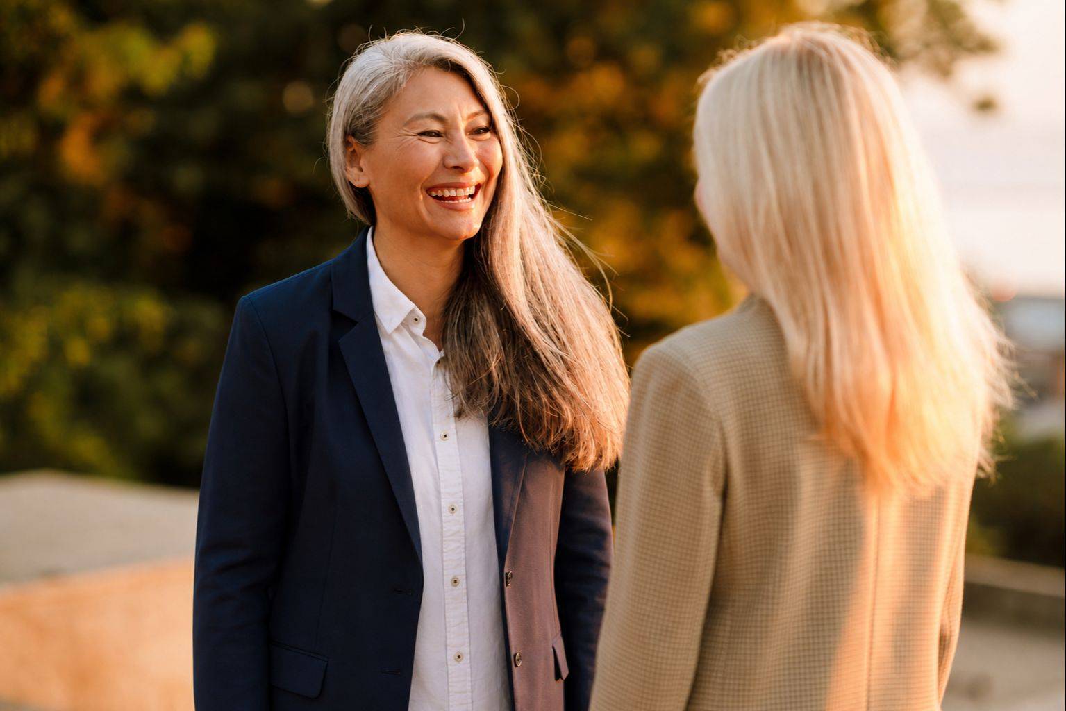 Two women in a coaching conversation practicing active listening.
