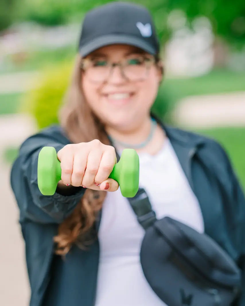 Board-certified obesity medicine physician using weights and weight lifting to preserve muscle while on a GLP-1