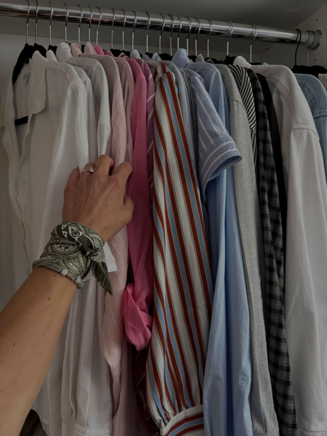 Jessi Sheehan editing a client's closet by hand