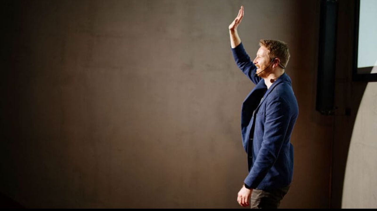 Man singing into a micorphone in a sound studio