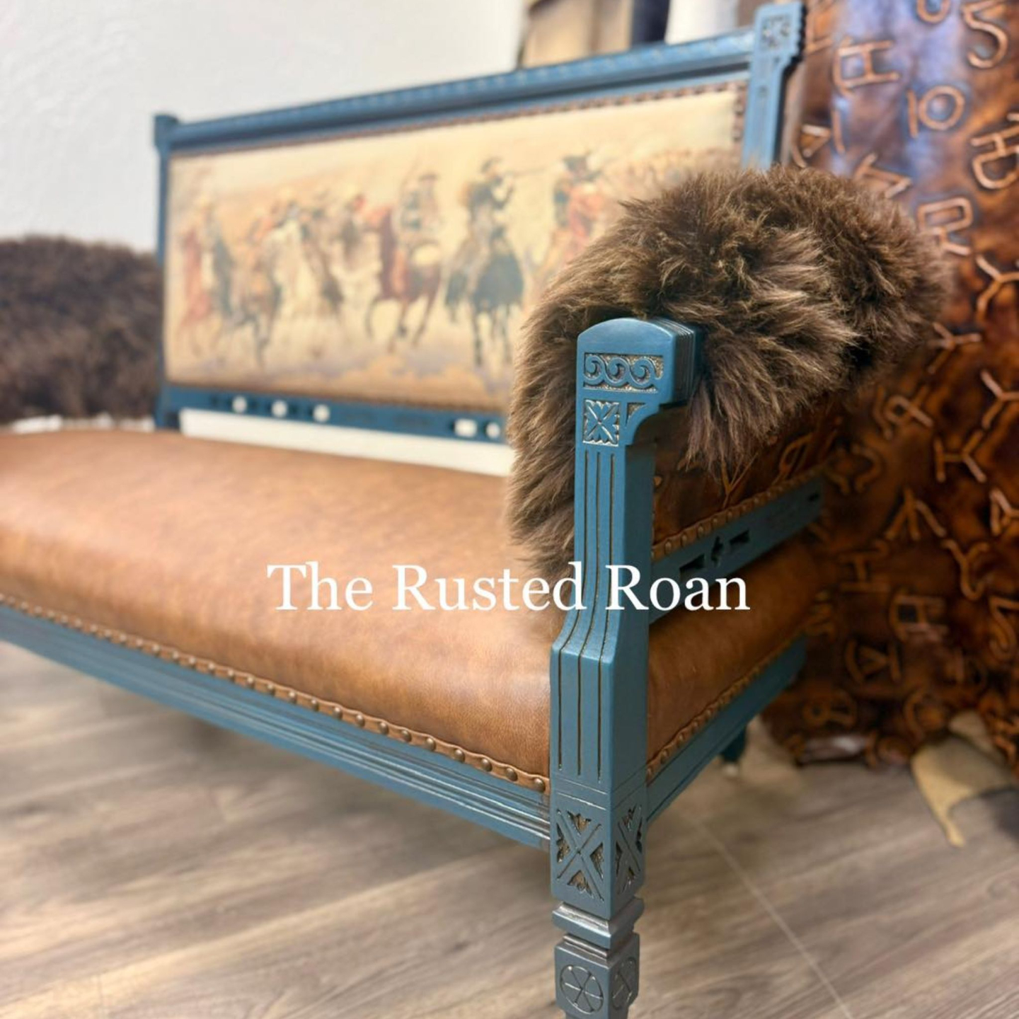 Bench seat upholstered in Charles Russel image printed on leather, leather seat and lambskin arms