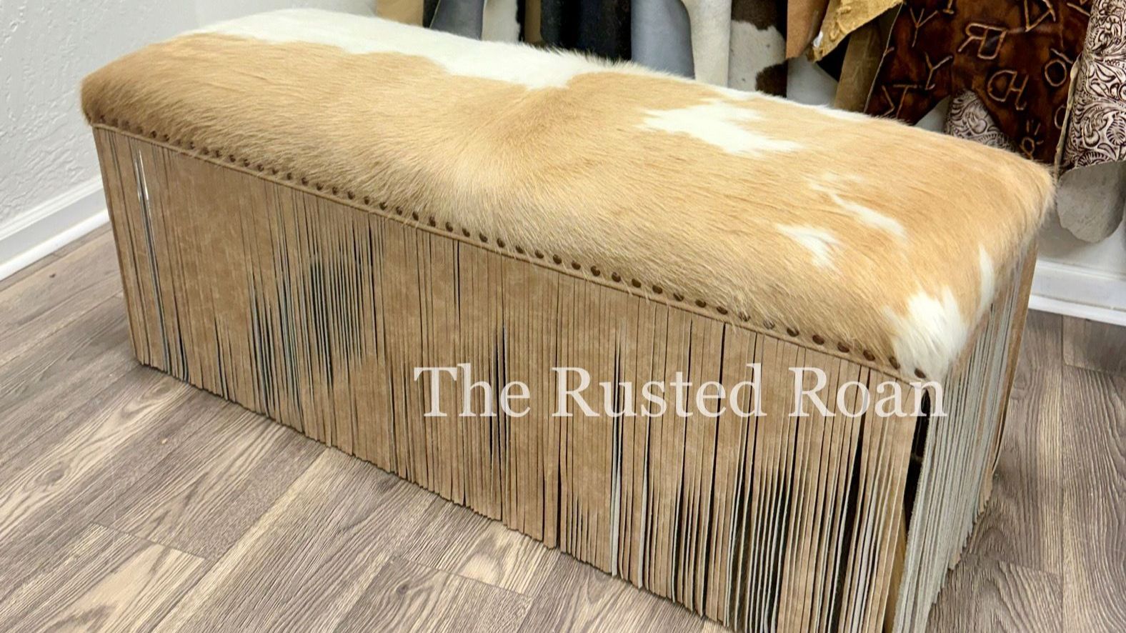 cowhide and leather fringe bench seat