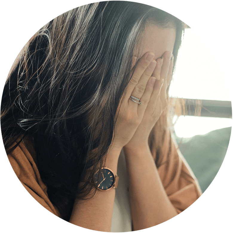 Worried mom with her head in her hands