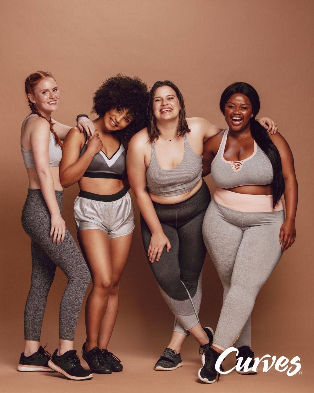 Group of Curves members smiling