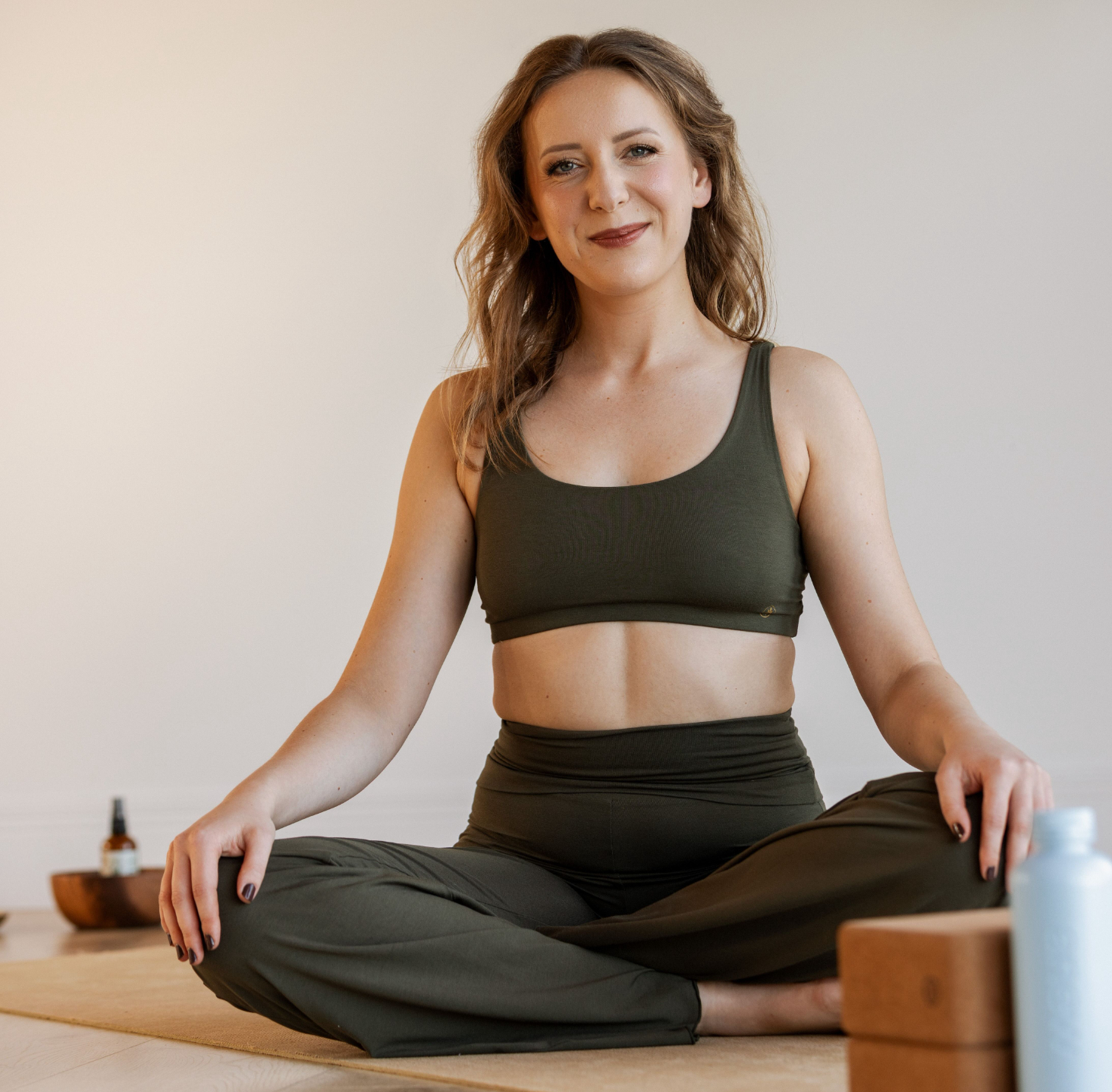 Image of Viktoria Levenberg, National Board-Certified Health Coach, Yoga Teacher in Lotus Pose