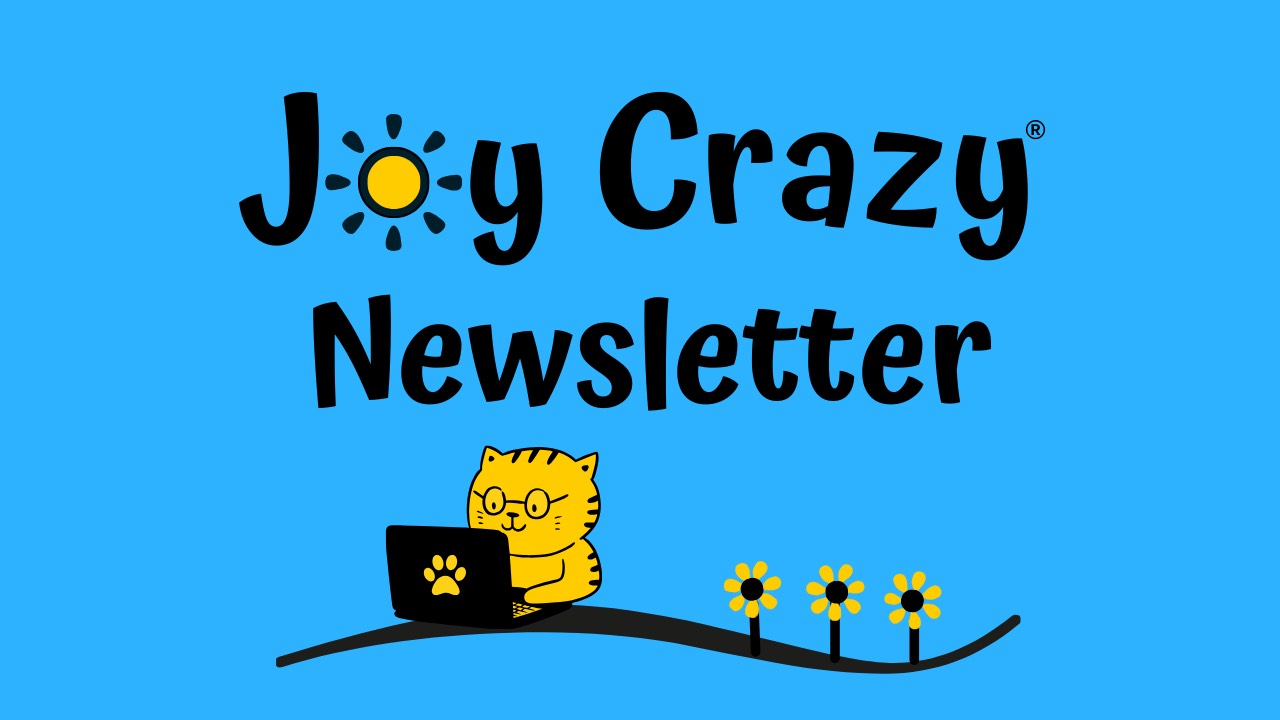 Logo for the Joy Crazy Newsletter features a cartoon cat sitting at a laptop reading the computer screen