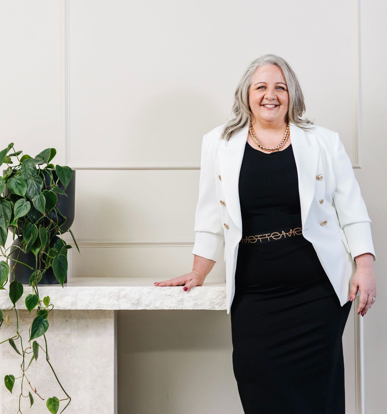 Nicki Kuurman smiling softly, founder of The Practical Mystic.