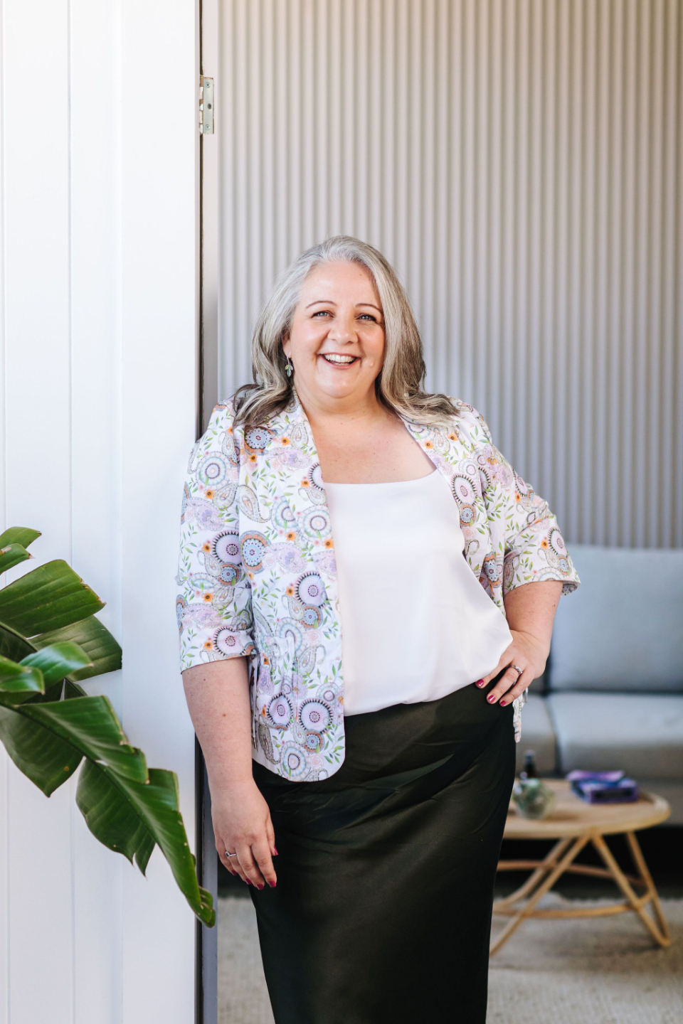 Nicki Kuurman standing in doorway welcoming into space for Aligned Journey session.