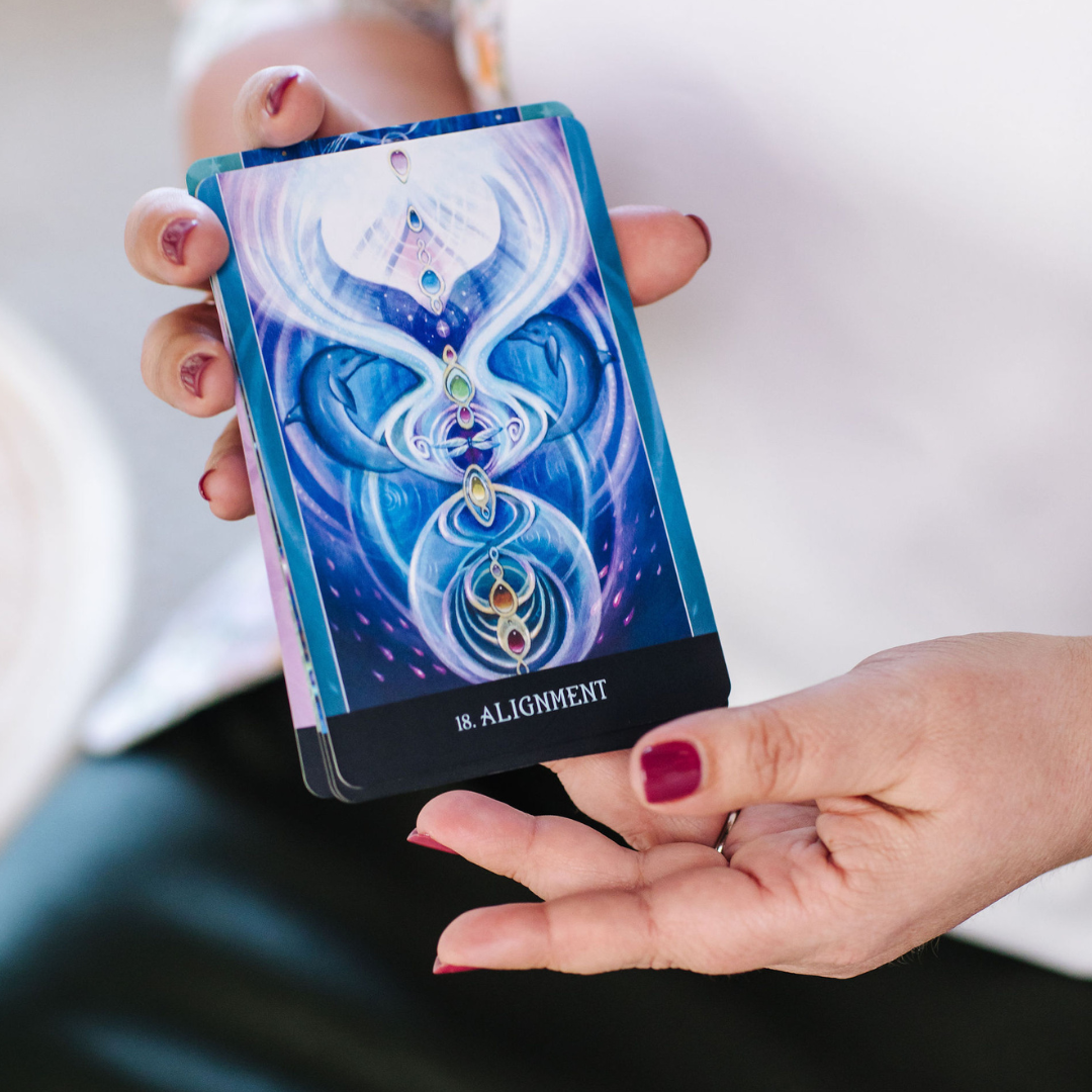 Close up of Nicki Kuurman holding Alignment oracle card from Beyond Lemuria Deck by Izzy Ivy