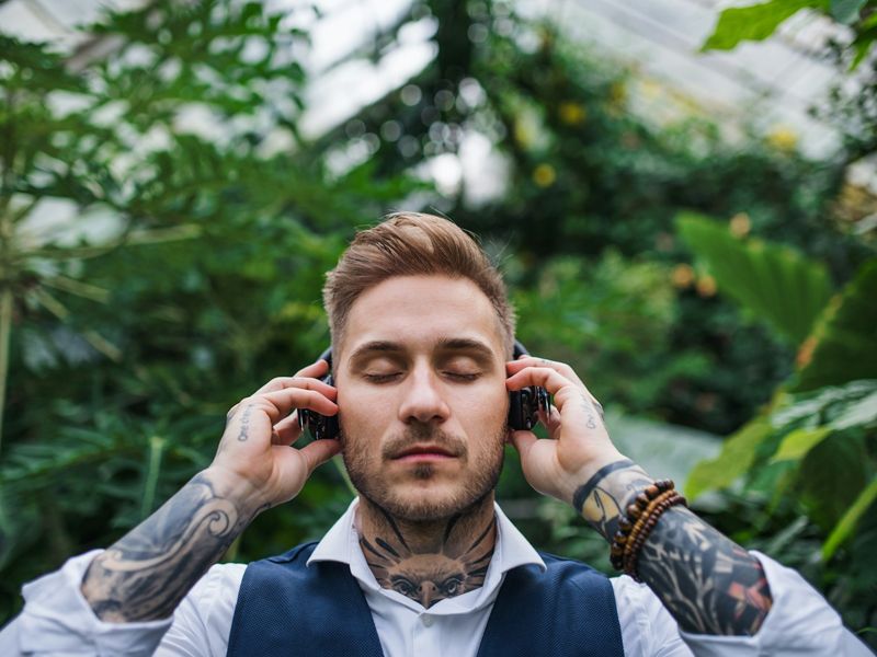 Man listening to a calming audio session, symbolising anxiety hypnotherapy helping retrain the mind for relief and clarity.