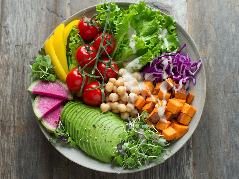 Bowl of colourful fresh vegetables and nutritious foods, symbolising healthy eating, balance, and a positive lifestyle - Retrained Minds Hypnotherapy.