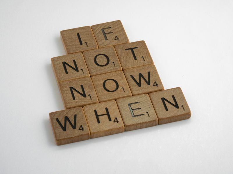 Scrabble tiles arranged to spell ‘If not now, when?’ symbolising motivation, self-belief, and taking action — Retrained Minds Hypnotherapy.