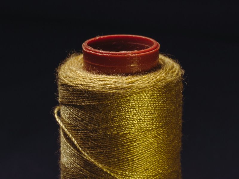 A golden thread representing connection, awareness, and personal growth at Retrained Minds Hypnotherapy