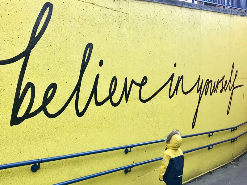 Wall mural that says ‘Believe in Yourself’, symbolising confidence, self-belief, and personal growth through hypnotherapy.