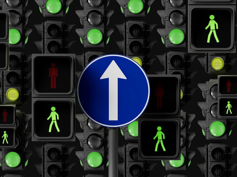 Traffic lights and an upward arrow symbolising positive behavioural change, direction, and progress through hypnotherapy.