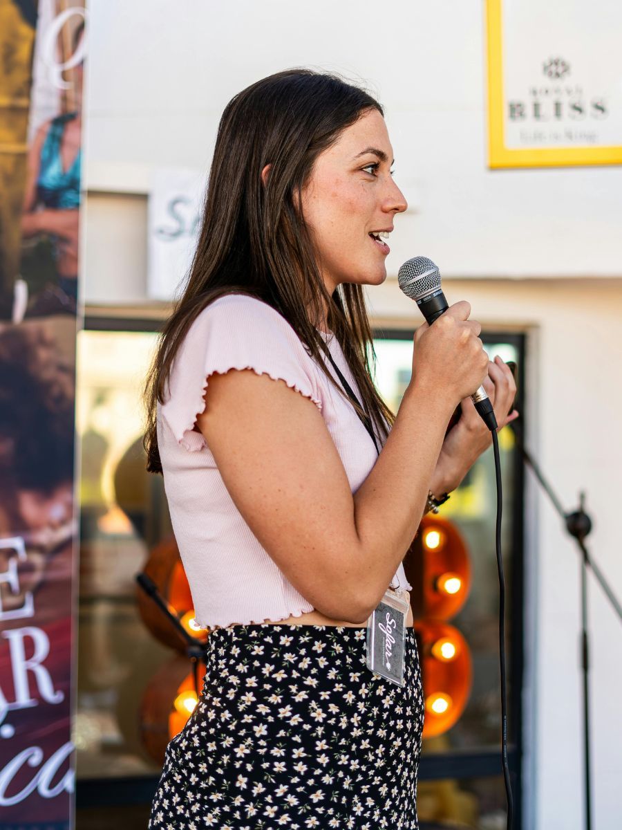 Speakeasy student giving a public speaking presentation in front of a live professional audience