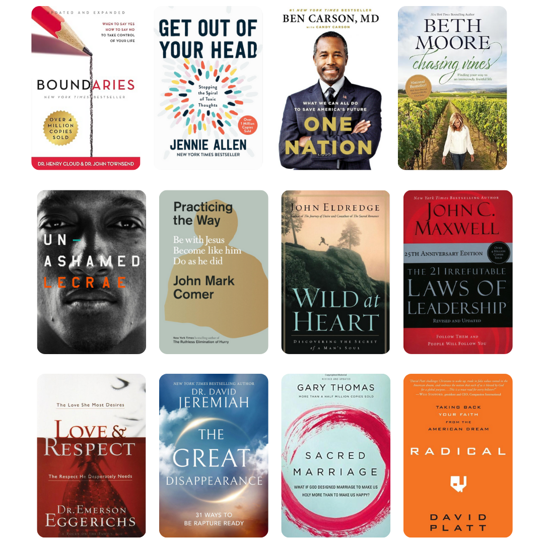 Smiling man reading a book by a bright window, representing growth, learning, and the author coaching journey.