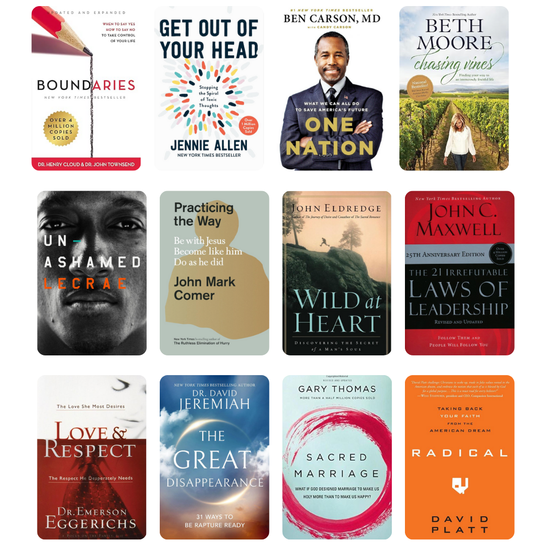 Smiling man reading a book by a bright window, representing growth, learning, and the author coaching journey.