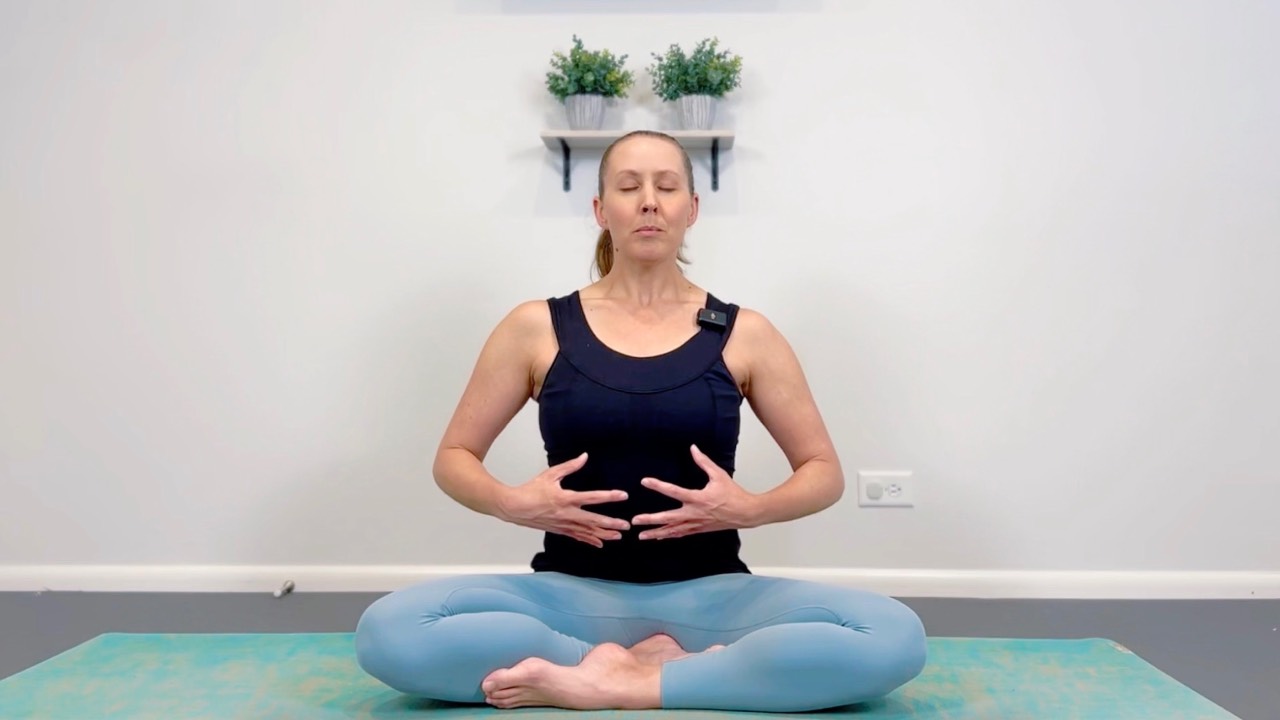 Black woman with her hands on her heart—part of the Breathwork course in the Complete Wellness Bundle.