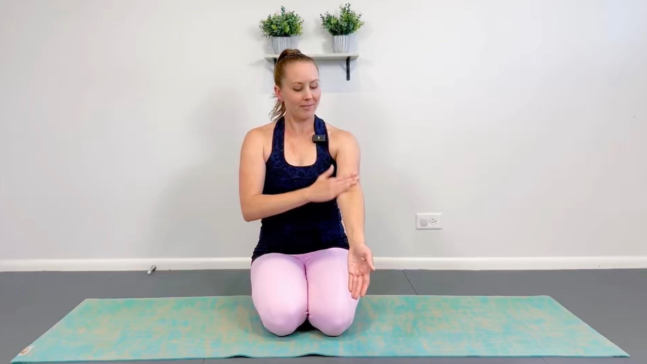 Black woman with her hands in prayer pose—part of the bonus content in the Complete Wellness Bundle.