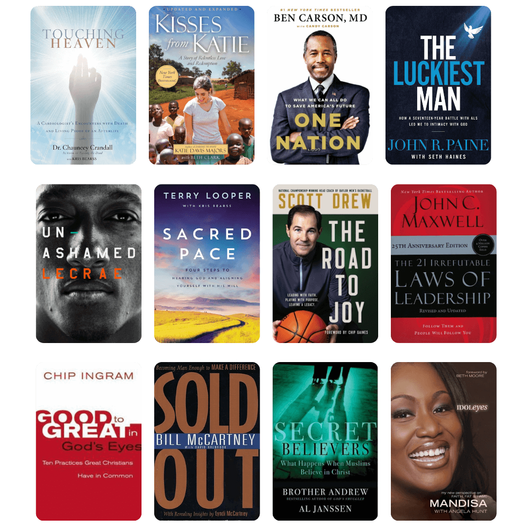 Smiling man reading a book by a bright window, representing growth, learning, and the author coaching journey.