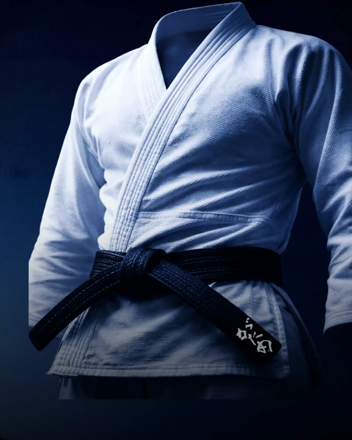 Black belt judoka in dramatic lighting
