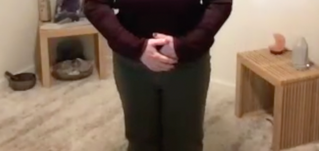 men in medical qigong posture with right hand (Yáng) closest to the body, with the left hand (Yīn) on top.