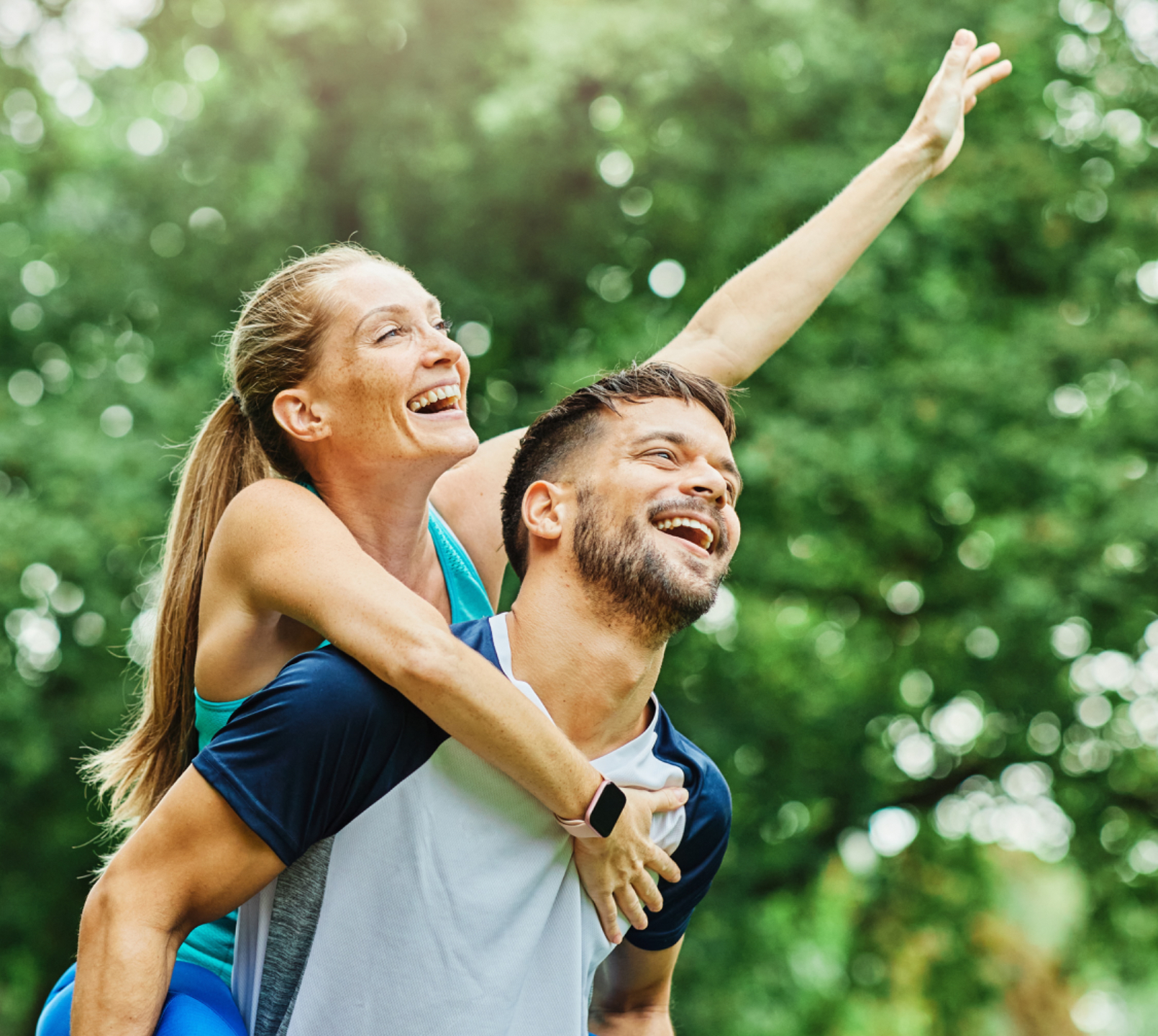 Smiling Woman piggy-back riding on a man