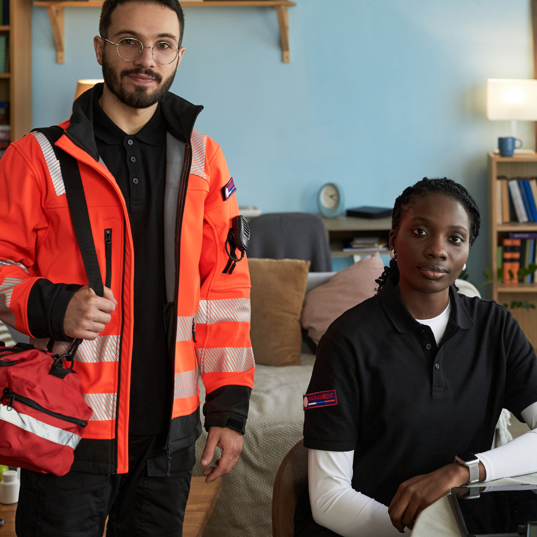 two EMS workers looking at the camera