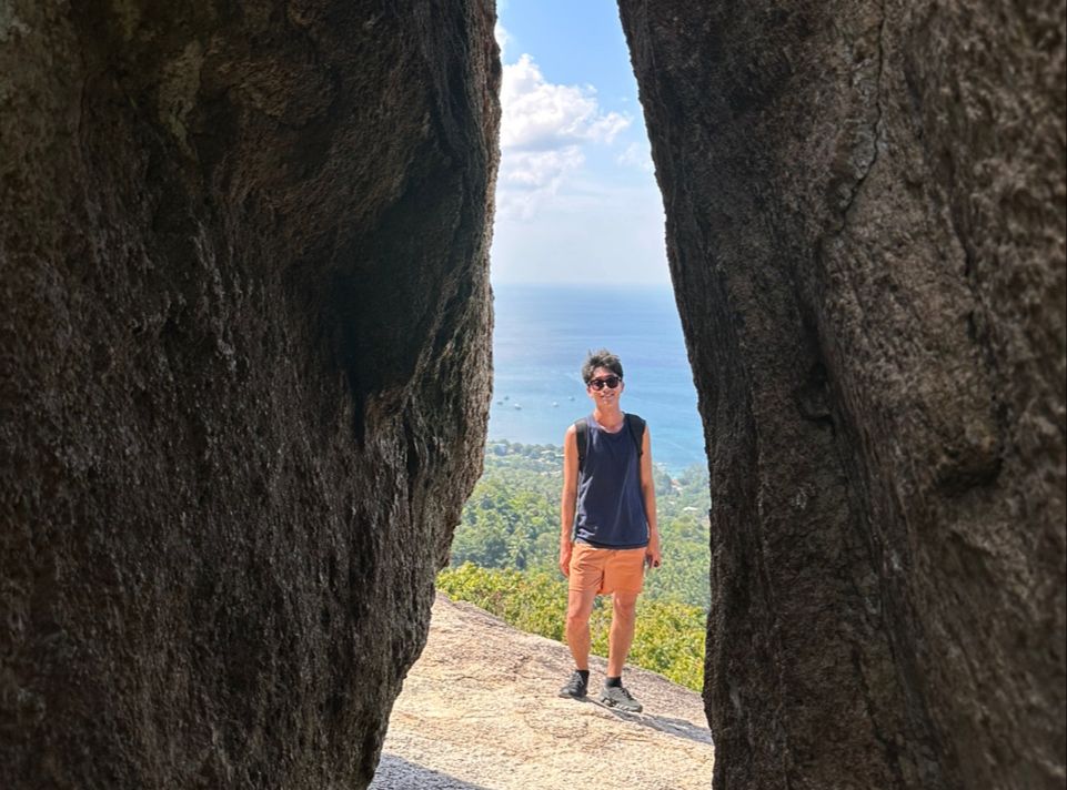 a founder is standing between of two rock