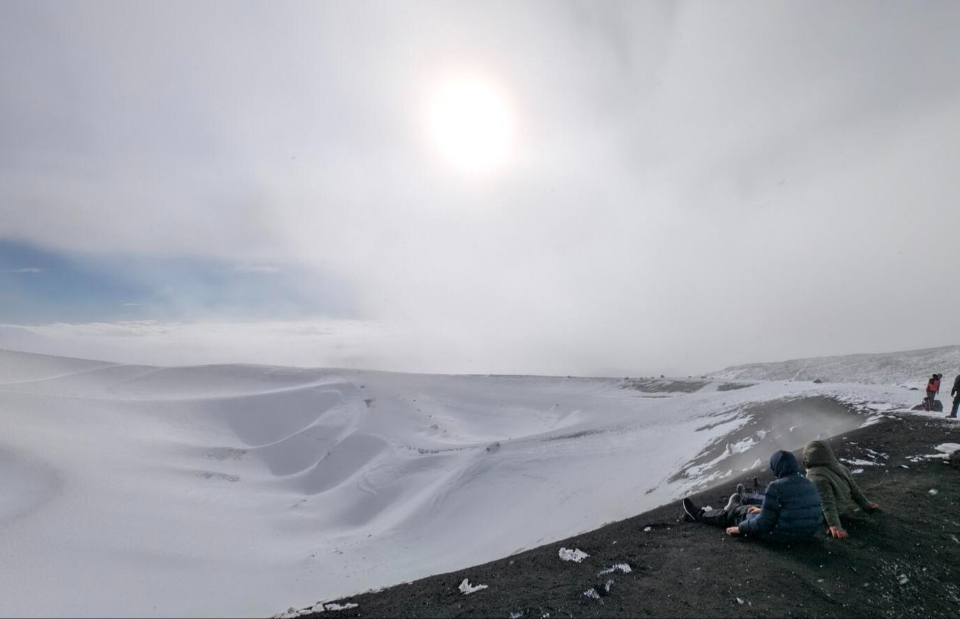 The kids sitting on the edge of a crater of Etna volcano, Sicily 2025