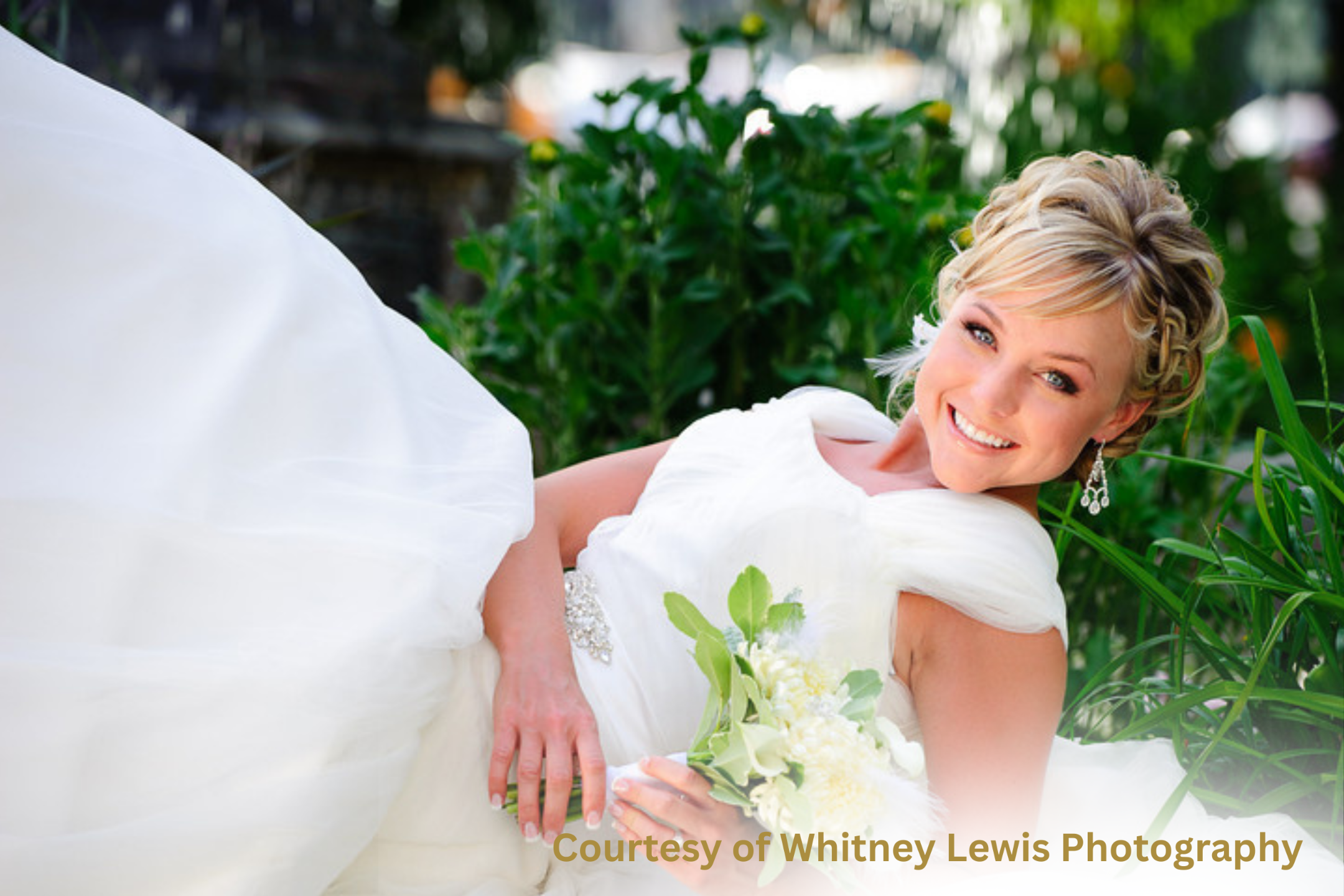 Radiant Latter-day Saint bride in a modest white wedding gown holding a delicate bouquet, symbolizing joy, purity, and temple-ready elegance. Image courtesy of Whitney Lewis Photography.